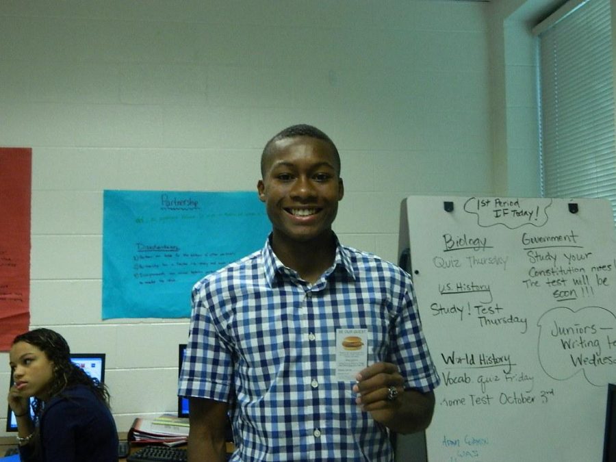 Senior Avery Braxton happily accepts his free Chick-fil-A coupon.