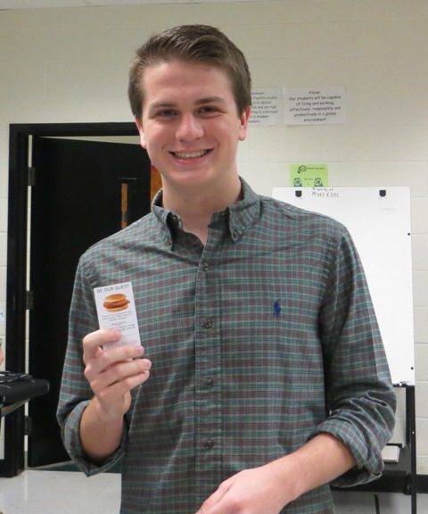 Junior Matt Marlow smiles as he accepts his Chick-fil-a free sandwich coupon from a member of the MHS Trail staff. 