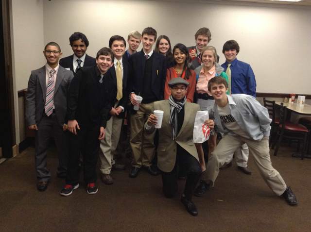 Debate team poses at Chick-fil-A after their victory at Jackson High School