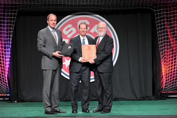 Coach Colvin accepted his award from the NSCAA.