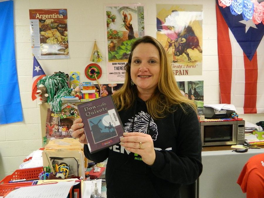 Mrs. Togneri holds her chosen movie for foreign language week