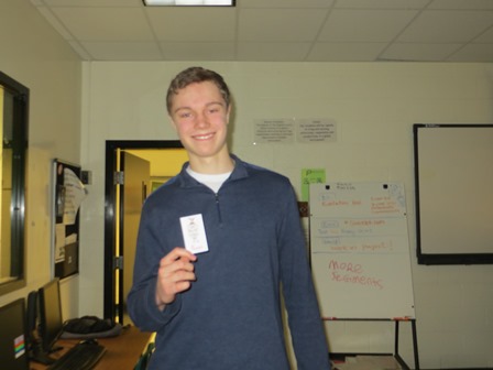 John Hamlin poses with the Chick-fil-a free sandwich coupon after waiting nearly a week to receive his prize.