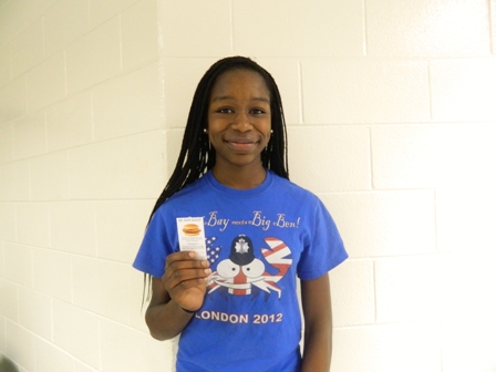 Ngozi grins as she poses with her second ever win from the Chick-fil-a "C" contest.