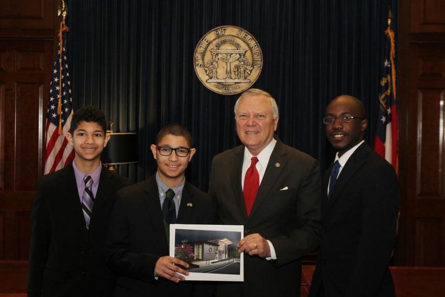 Andrew and his younger brother, Jacob pose with Nathan Deal