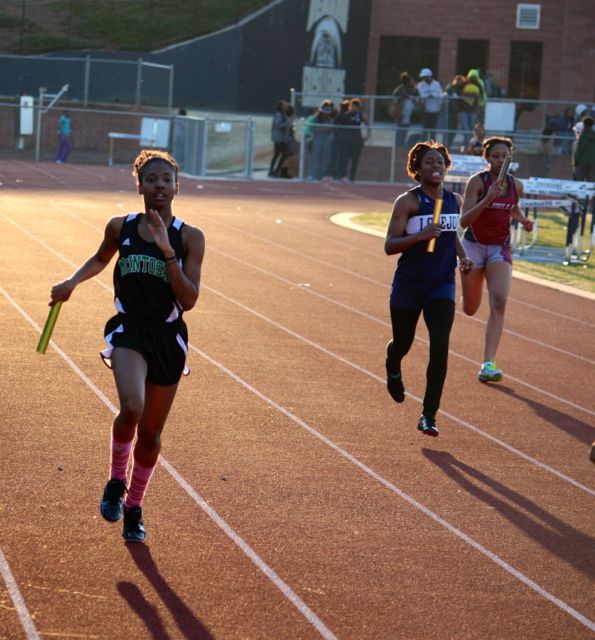Junior Morgan Frederick (far left) leads off on the girls 4x400 meter relay. 