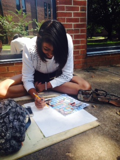 Senior Vanessa Sims working on collage project