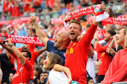 Liverpool fans cheer during a pre-season match against AC Milan. 