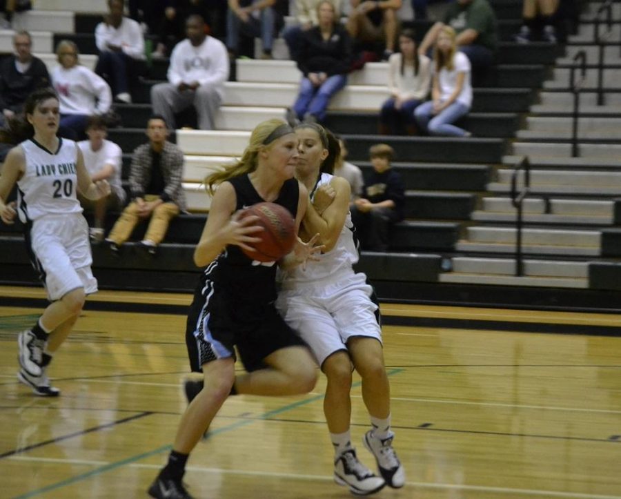 Freshman Kimmie Edgeworth goes up against a Lady Panther. 