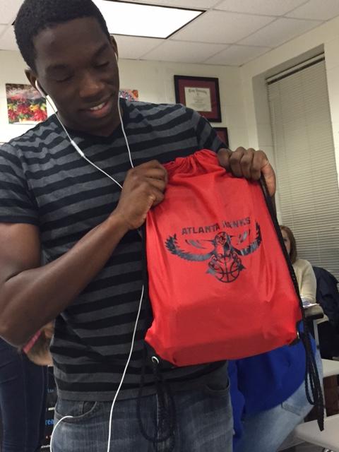 Senior Alexander Gipson displays his Atlanta Hawks string bag. 