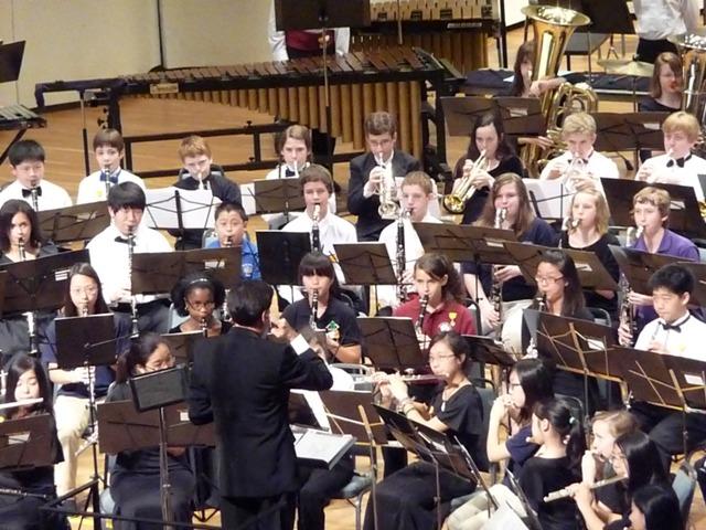 All-State Band members under the direction of Eric Morales perform at the Convention Center in Savannah, Georgia. All-State events, except for All-State Jazz Band, have since moved to Athens, Georgia.