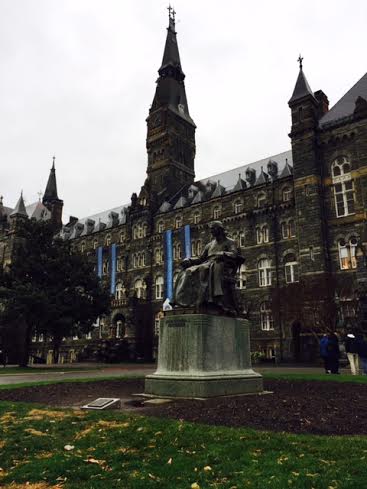 The statue of John Carroll, founder of Georgetown University, stands in front of Healy Hall. The site is one of the historic landmarks of the university.