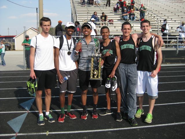 A group of last years senior boys celebrates with their county championship trophy. Coach Jason Newton said, I am looking forward to another successful track season. 