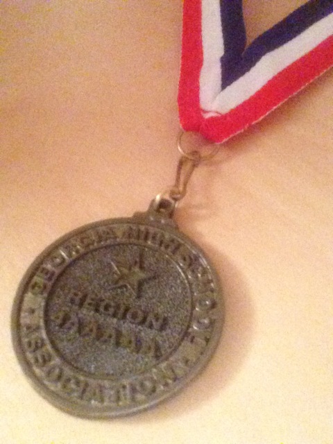 Junior Christina Cortes medal that she received from competing at the literary competition.  