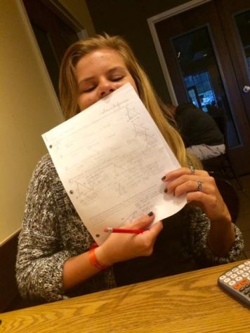 Senior Liana DeJourdan is happy to study with the extra boost of caffeine her caramel mocha provided.
