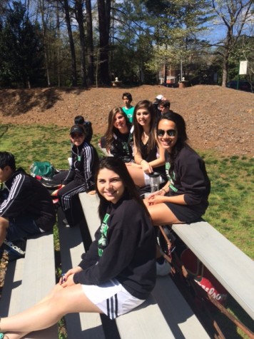 Some of the girls team cheering on the deciding boys match to advance to the second round