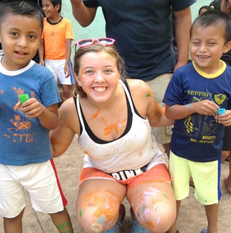 Senior Katie Close plays with the children in Guatemala during her second Spring Break mission trip. 