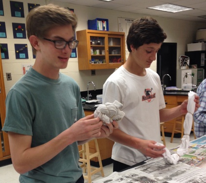Sophomores Cooper Ulrich and Ron Johnson work diligently on their tie dye masterpieces.