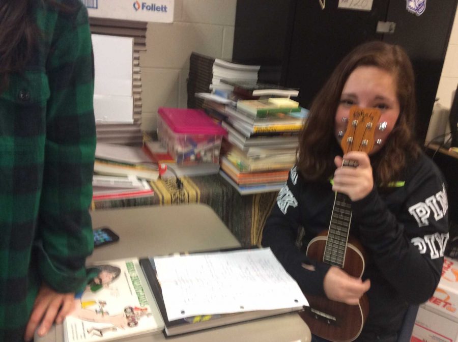 Junior Christina Cortes poses with her ukuelele, which she used to perform her song "Paraiso" with her partner Junior Anna Brachey.