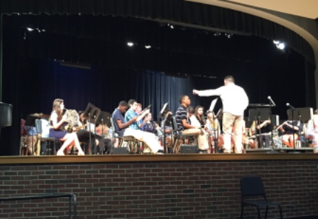 Corey Newton prepares the third and sixth period band classes for their concert.