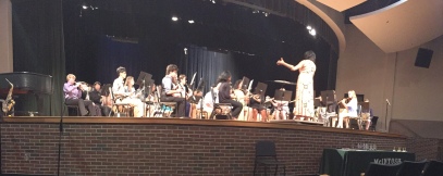 Ms. Baker conducts the fourth period band in their first piece of music.
