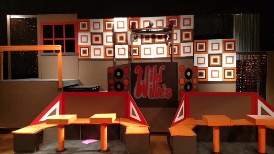 The set was designed and painted by Senior Erika Gauvin. 