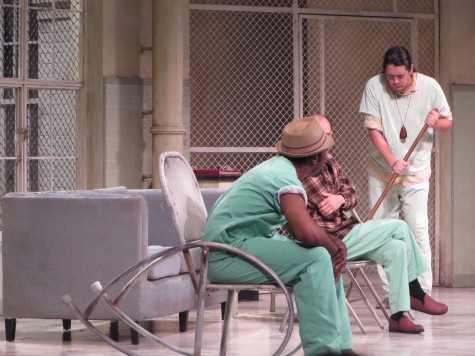 Insane Asylum patients talk and converse with new patient McMurphy. Notice how compared to the other characters McMurphy has his sleeves rolled up and keeps his persona, while the other characters clothing is yellowed and suggests age and defeat.