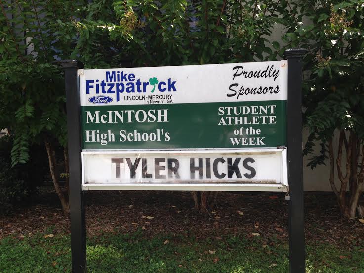 Student+athlete+of+week+sign+depicting+senior+Tyler+Hicks+name.