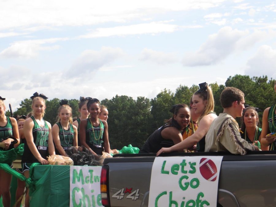 McIntosh cheerleaders support the Chiefs as they participate in the parade on Wednesday, Sept. 30.