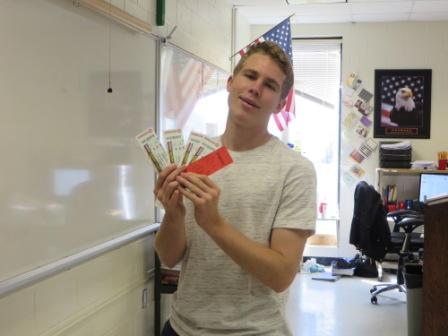 Owen Miller accepts his Atlanta Hawks basketball tickets he won throuhg the MHS Trail give away. The tickets were close to court side and included food discounts and a parking pass. 