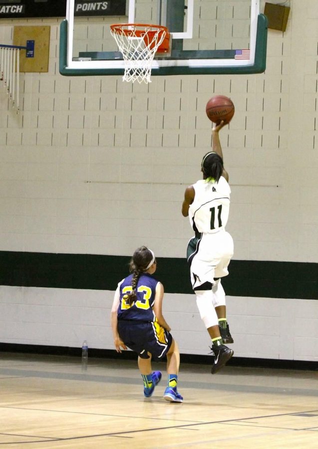 Freshman Kennedi Miller goes for the layup during her last season of middle school basketball.