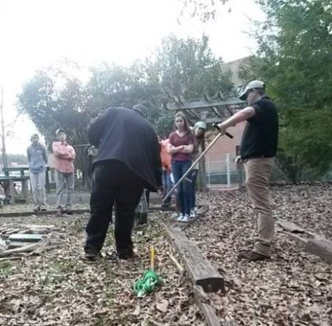 Arborist Brian Ziegler and Nick Steward demonstrate tools to the class.
