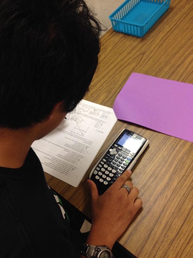 Junior Victor Cama prepares for the AP Physics 1 midterm.