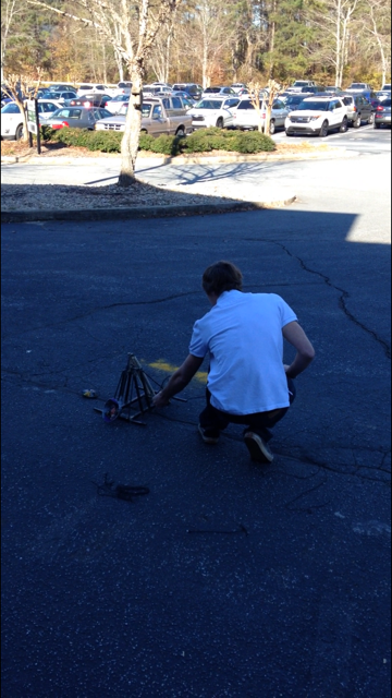 Junior Dylan Dodge prepares to launch his catapult.