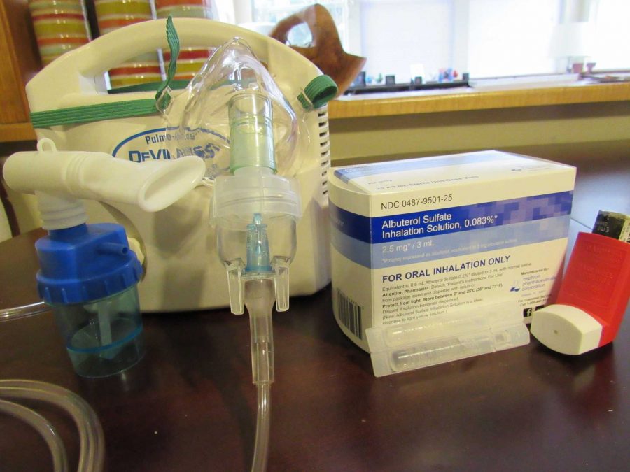 A nebulizer has a mouth piece and mask. 