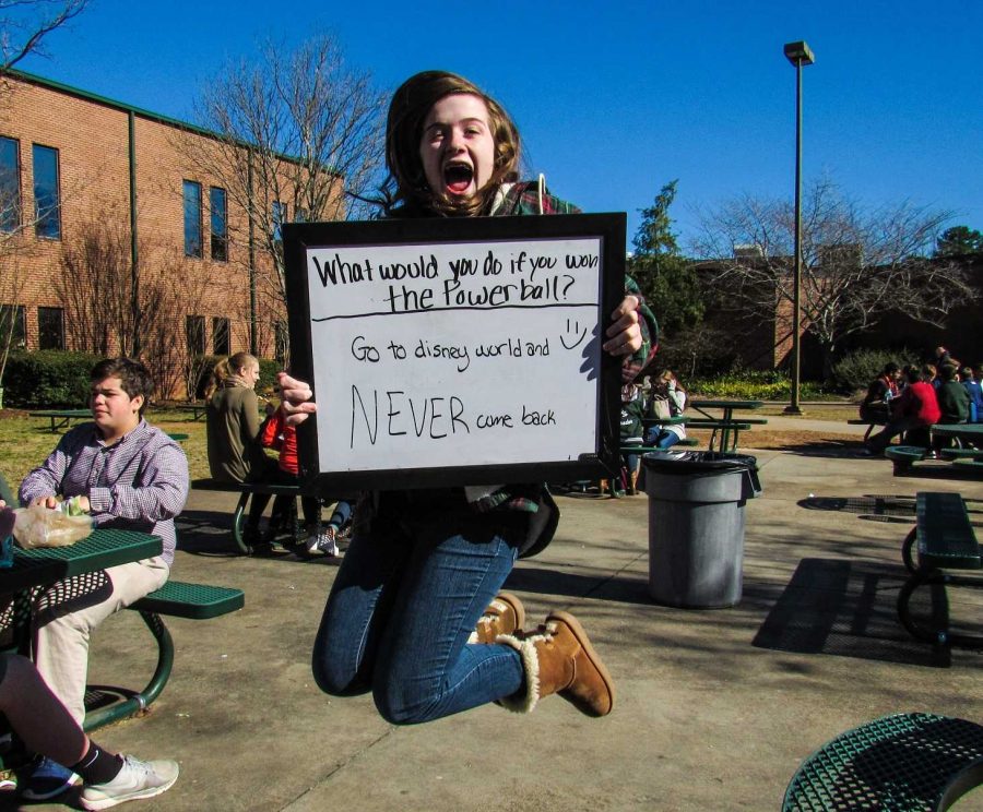 Sophomore Maddie Ludecke said she visted Disney World over Thanksgiving Break. She also said that it is the happiest place on Earth. She jumps for joy at the thought of going to Disney World and never coming back. Her lunch table friends giggle as she poses.