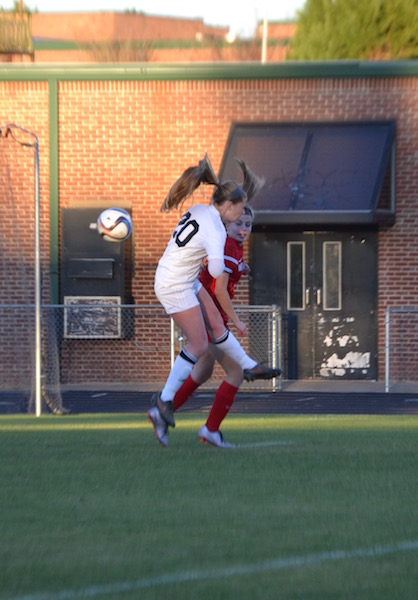 Junior Chandler Witucki goes up for a header. 