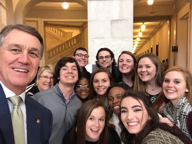 McIntosh students, teacher Ms. Edenfield, and Georgia senator David Perdue take a selfie at Capitol Hill.