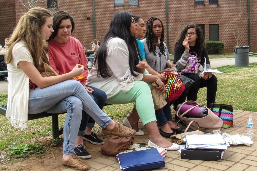 Freshman Samori Cullun and her friends talk about their school work.