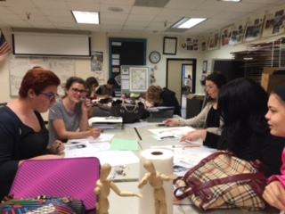 Visual arts students work on their portraits after school while enjoying lolly pops