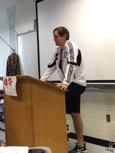 Latin III student junior Dylan Keysar presents his translated passage to the class for Cicero presentations. 