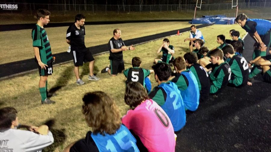 The team receives instruction during halftime.