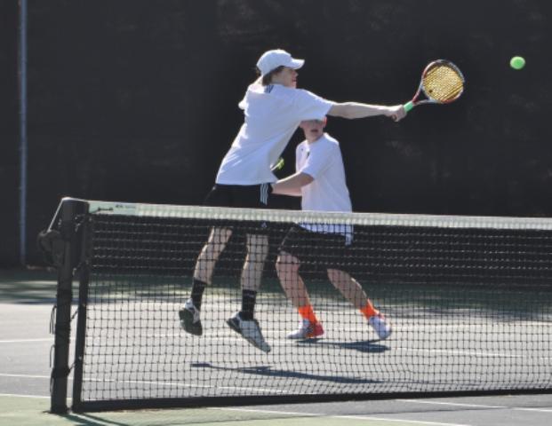 Juniors Harry Immel and Caleb Minor play doubles during their tennis match against Lowndes High School.