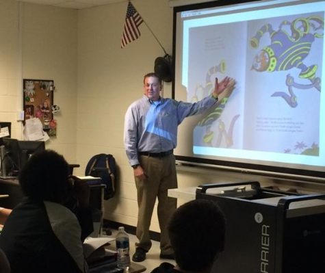 Mr. David High explains to his class the truth behind Dr. Seuss' book, "The Butter Battle Book."