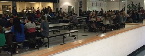 Students sit down to eat A lunch.