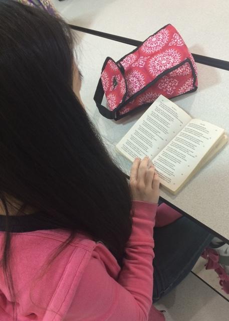 Sophomore Jeanna Speck studies "The Inferno" during lunch.