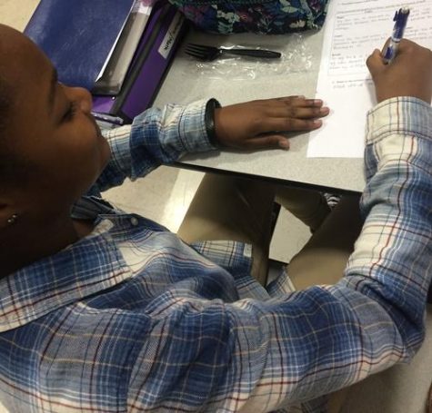 Sophomore Nadia Coleman studies for math at lunch.