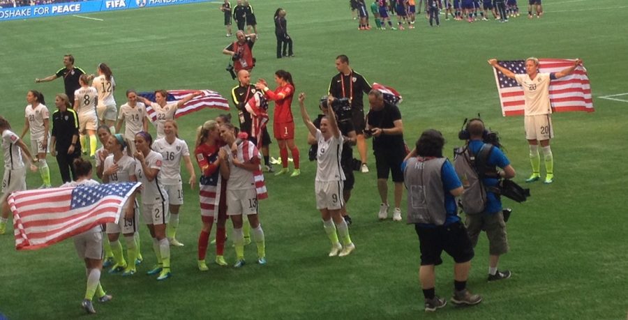 Abby Wambach (right) celebrates the 2015 Women's World Cup Victory with her team in Vancouver.