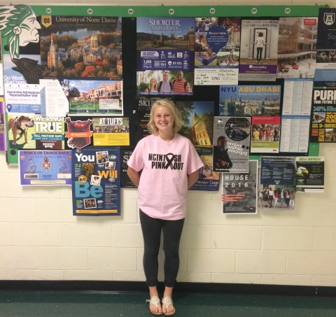 Senior Clara Comiskey sports her newly bought Pink Out shirt. The proceeds from the shirt sales go toward breast cancer research. 