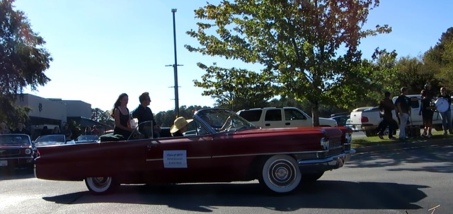 Seniors Porter Enstrom and Rachel Ward join the parade in Porters convertible.