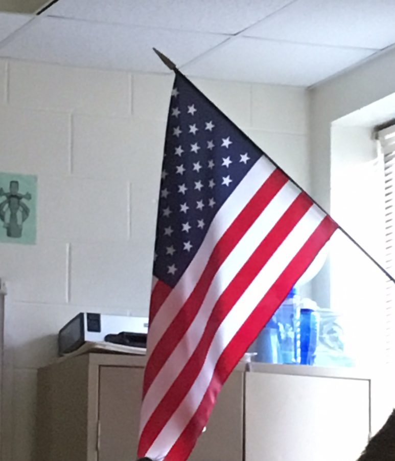 American+flags+hang+in+every+classroom+at+McIntosh.+Students+have+the+choice+to+participate+in+the+Pledge+of+Allegiance+each+morning.+This+choice+is+one+of+the+freedoms+that+the+U.S.+offers+its+citizens%2C+and+this+freedom+appeals+to+people+living+in+countries+with+harsher+laws.+These+choices+are+one+of+the+factors+that+already+makes+America+great.